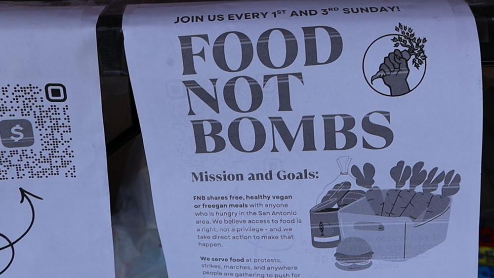 Food Not Bombs flyer taped to the coalition table.